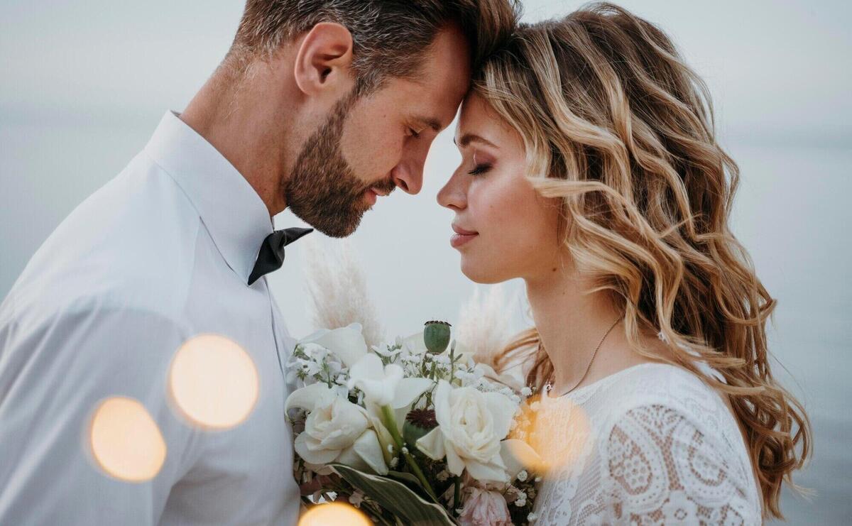 Young bride and groom having a beach wedding