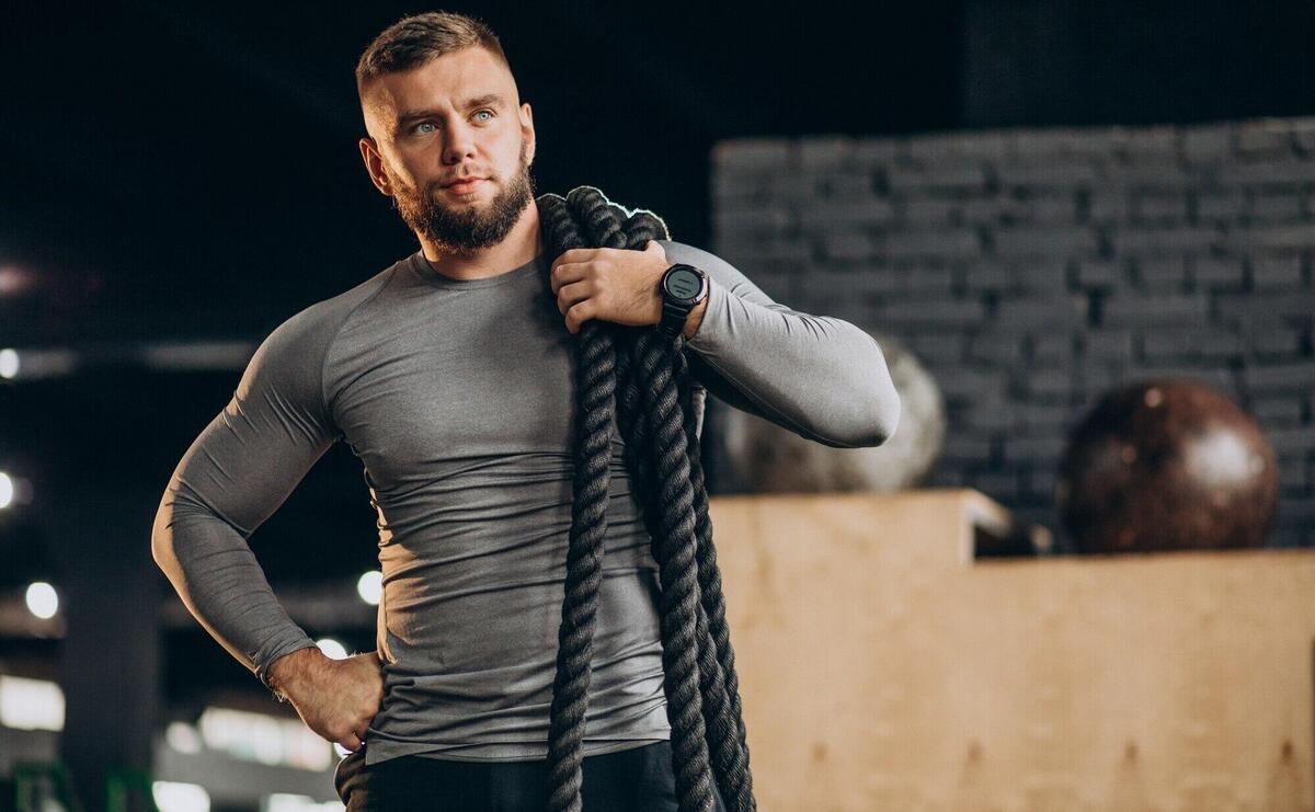 Handsome man exercising at the gym