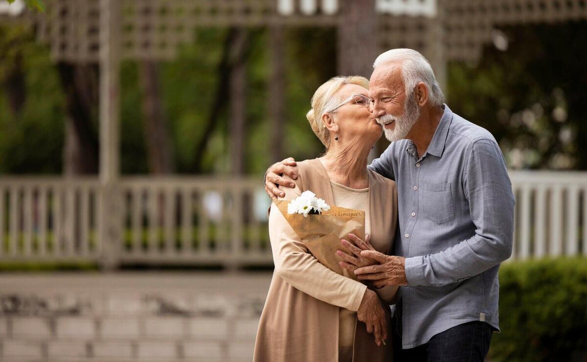 Medium shot woman kissing man on cheek